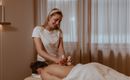 A professional provides a massage with special devices in a quiet room. The atmosphere is relaxing and friendly.