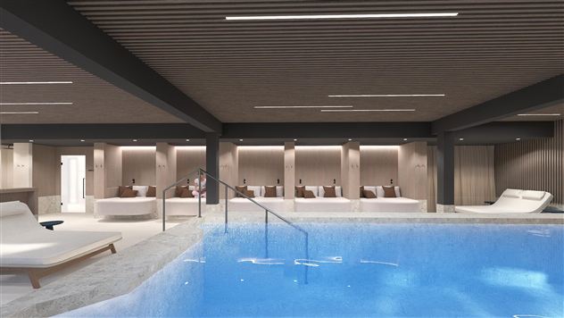 A modern wellness area with a clear, blue pool.  
Relaxation loungers invite you to linger.