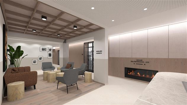 A modern lounge atmosphere with comfortable seating and a minimalist design. A decorative plant and some artworks complement the space.
