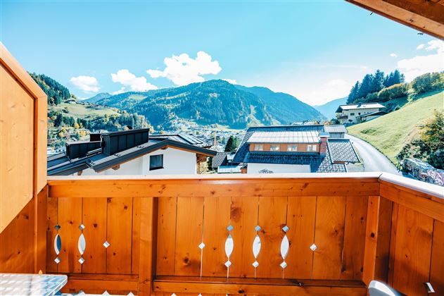 A picturesque view from the balcony of the mountains and the valley. The clear air and the blue sky invite relaxation.