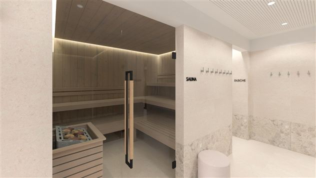 A modern wellness area with a sauna and a shower area. The walls are in neutral tones and there are cozy wooden shelves.