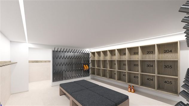 A modern changing room with wooden doors and a bench area. The walls are light, and in the background, lockers with numbers are visible.