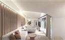 A modern living room with bright interiors and large windows. There are comfortable sofa sets and minimalist design.