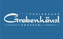 A logo of the holiday home "Grabenhäusl" in Großarl. It features appealing lettering on a blue background.