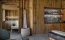 A modern spa with wood paneling and a sauna. The room is designed to be cozy and inviting.